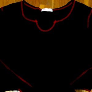 Black long sleeve with red contrast stitching.